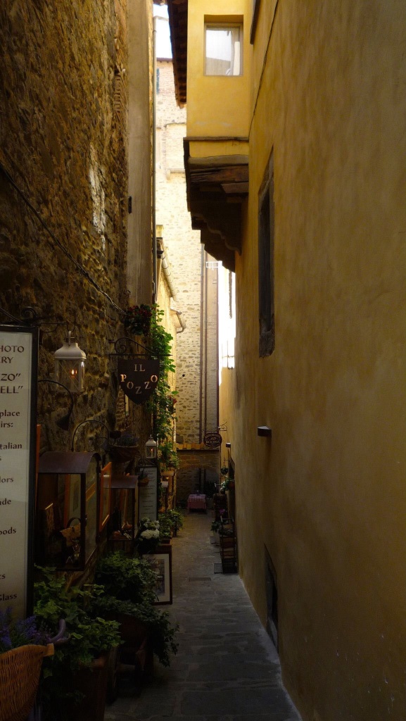 Cortona's little side streets are well worth exploring to find hidden gems like this charming photo gallery on the left.